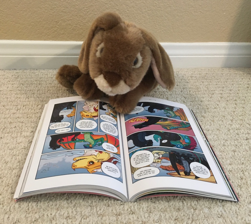 Caramel enjoys reading and also looking at the pictures of The Hidden Kingdom, (Book Three of Wings of Fire) by Tui Sutherland and Mike Holmes.
