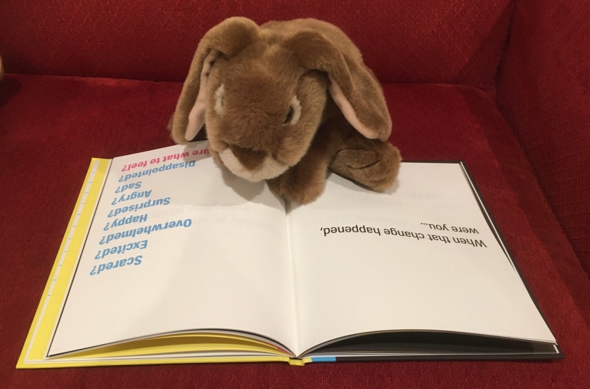 Caramel is reading A Kids Book About Change by David Kim.