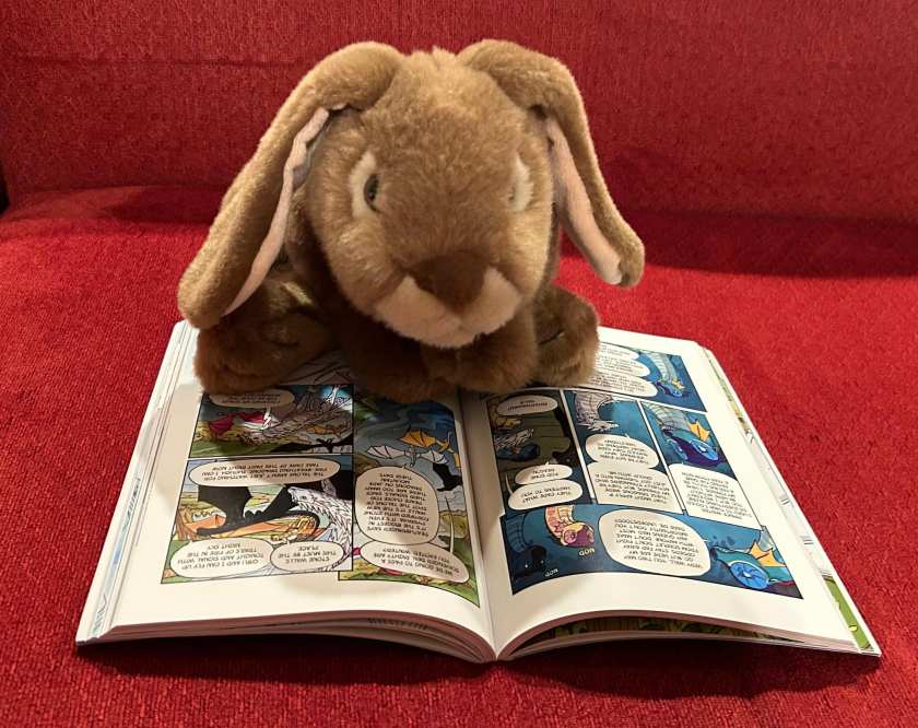 Caramel is reading Winter Turning: The Graphic Novel, by Tui Sutherland and Mike Holmes.